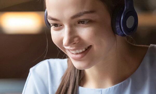 women smiling with headset on