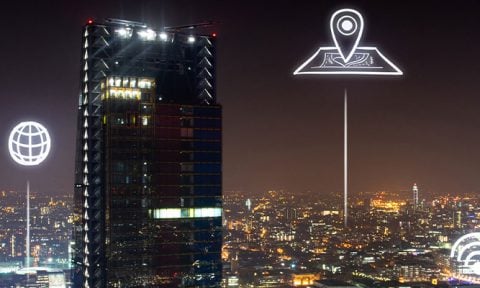 Ariel shot of London at night with icons of IoT Devices