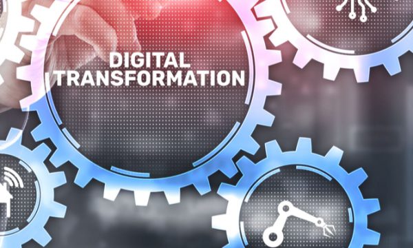 Graphic showing the words ‘digital transformation’ inside a cog with a person pointing towards it