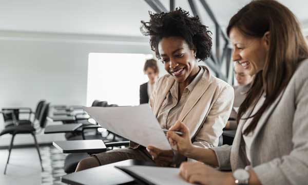 Females reviewing business documents