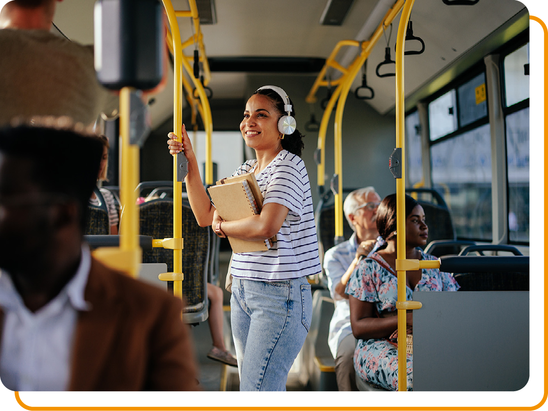 Image of a person stood up on a bus