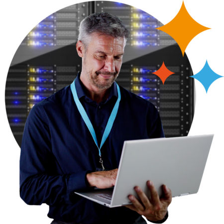 Image of a person working on a laptop in a data centre