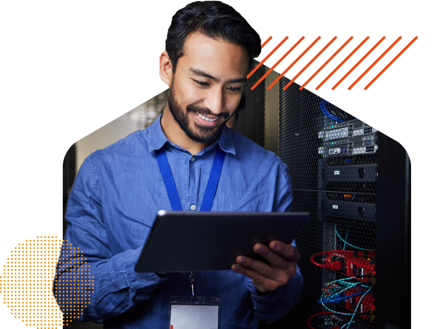 Technical person working on a tablet in a server room
