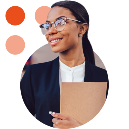 Image of a smiling business professional stood outside of a government building