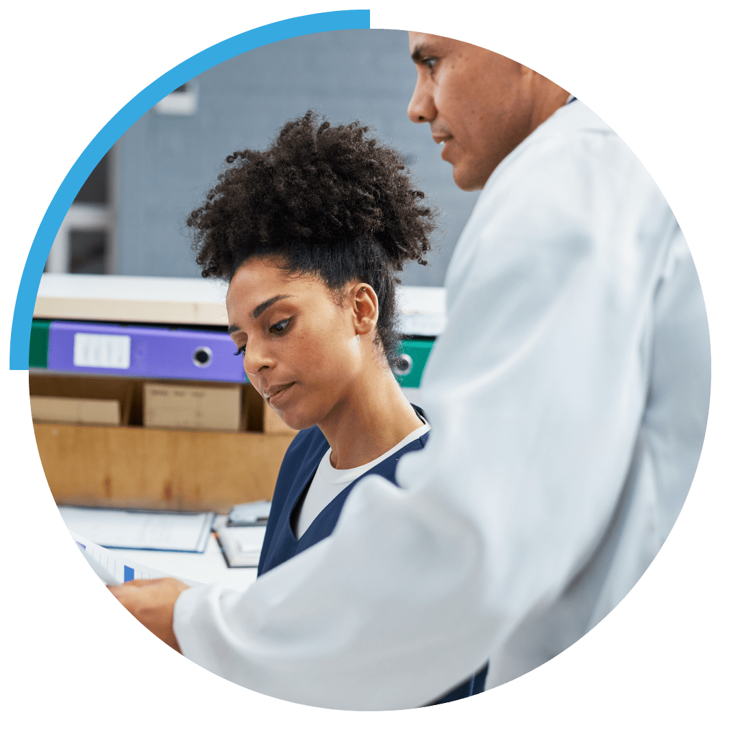 two healthcare professionals sat