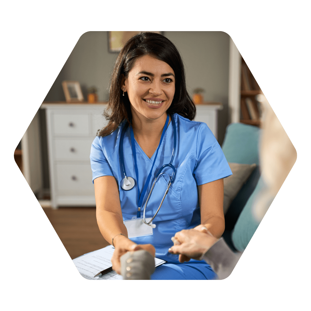Woman sat in healthcare uniform