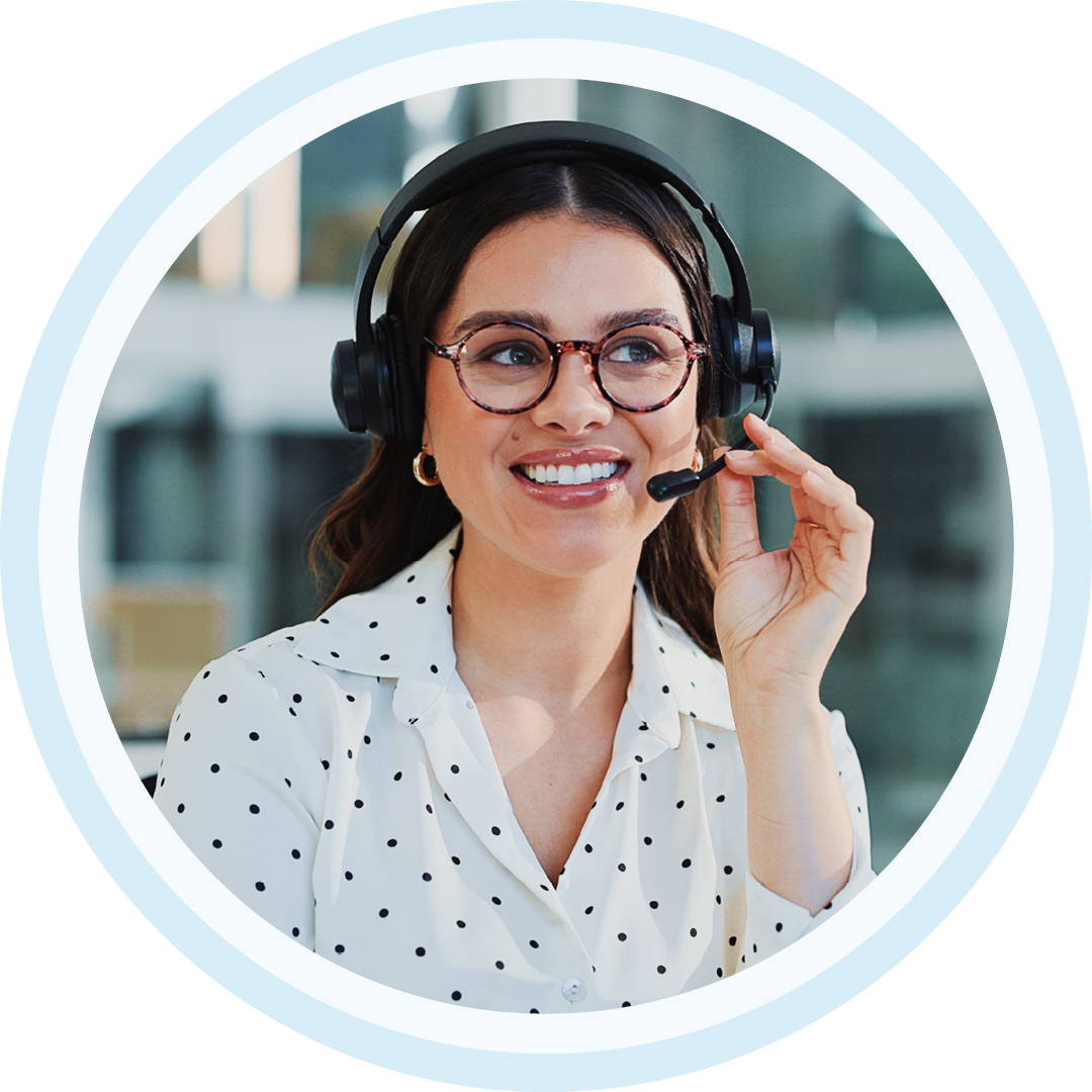 Woman smiling with headset on at work