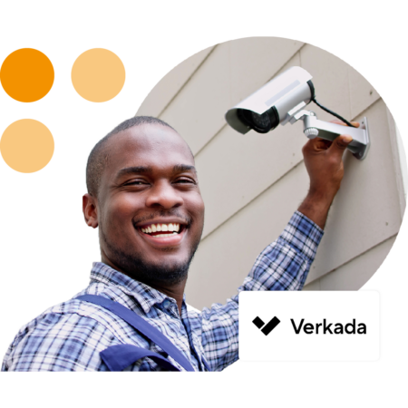 Image of a person installing a security camera with the Verkada logo