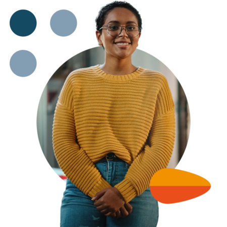 Image of a person stood smiling in an office