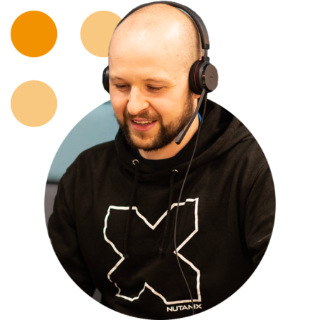 Image of a smiling Phoenix Software employee talking on a headset