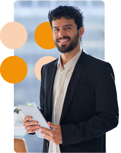 business man in suit holding tablet smiling at camera