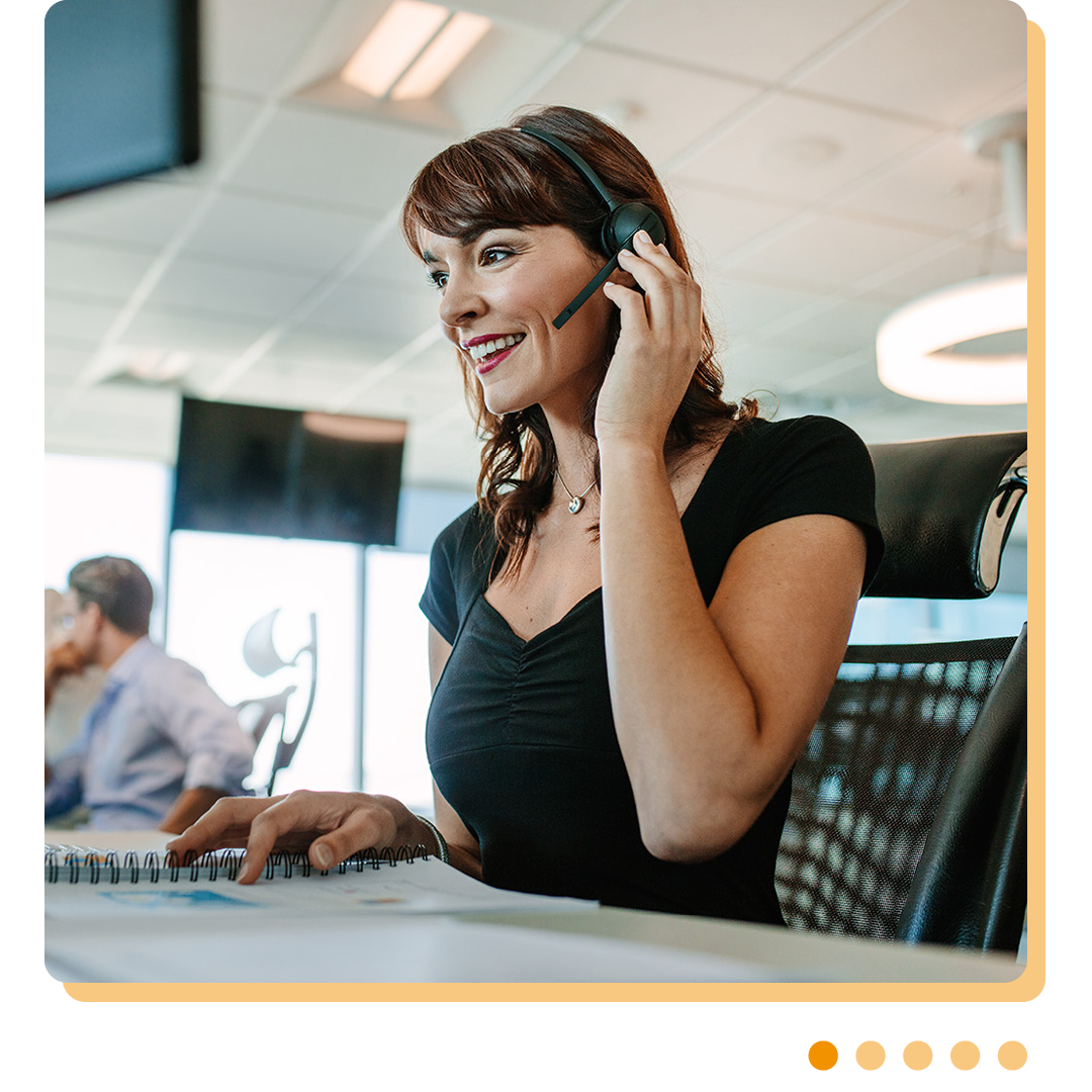 Image of a smiling IT support professional talking on a headset