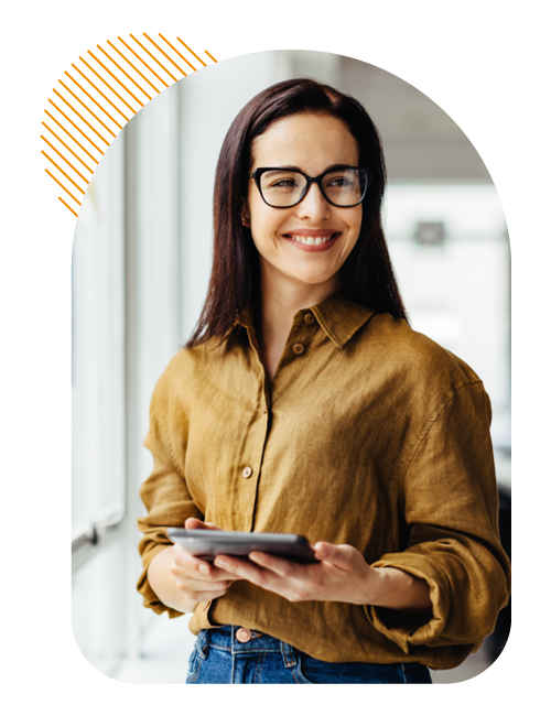 Image of a business professional stood holding a tablet