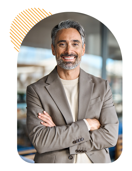 Image of a smiling business professional stood arms crossed