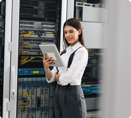 Image of an IT professional stood in a data centre