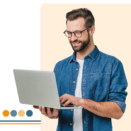Image of a person stood holding a laptop