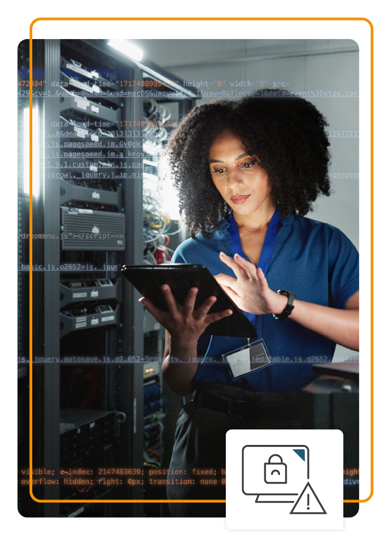 Person in a server room using a tablet device