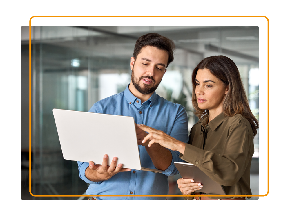 Man and women using a laptop