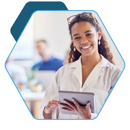 Smiling lady with tablet in lab coat