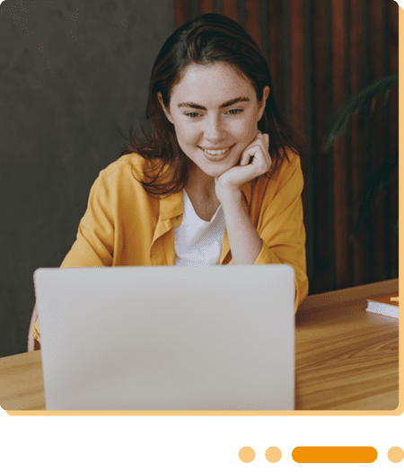 Image of a business professional working on a laptop