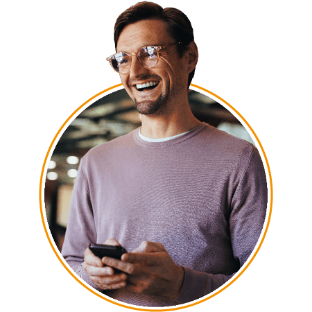 Image of a smiling business person holding a phone