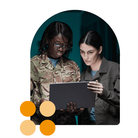 two women in army with tech/laptop