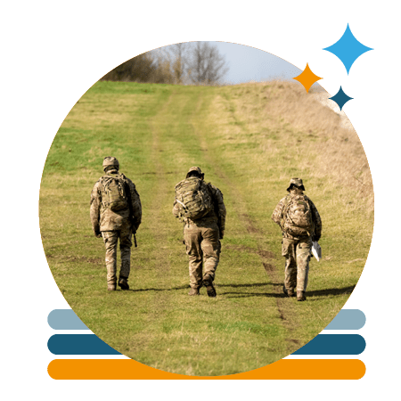 3 soldiers marching on a field in uniform