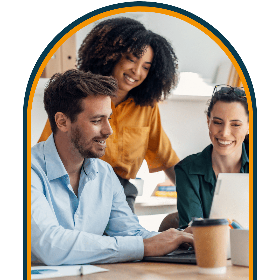 three colleagues chatting around laptop