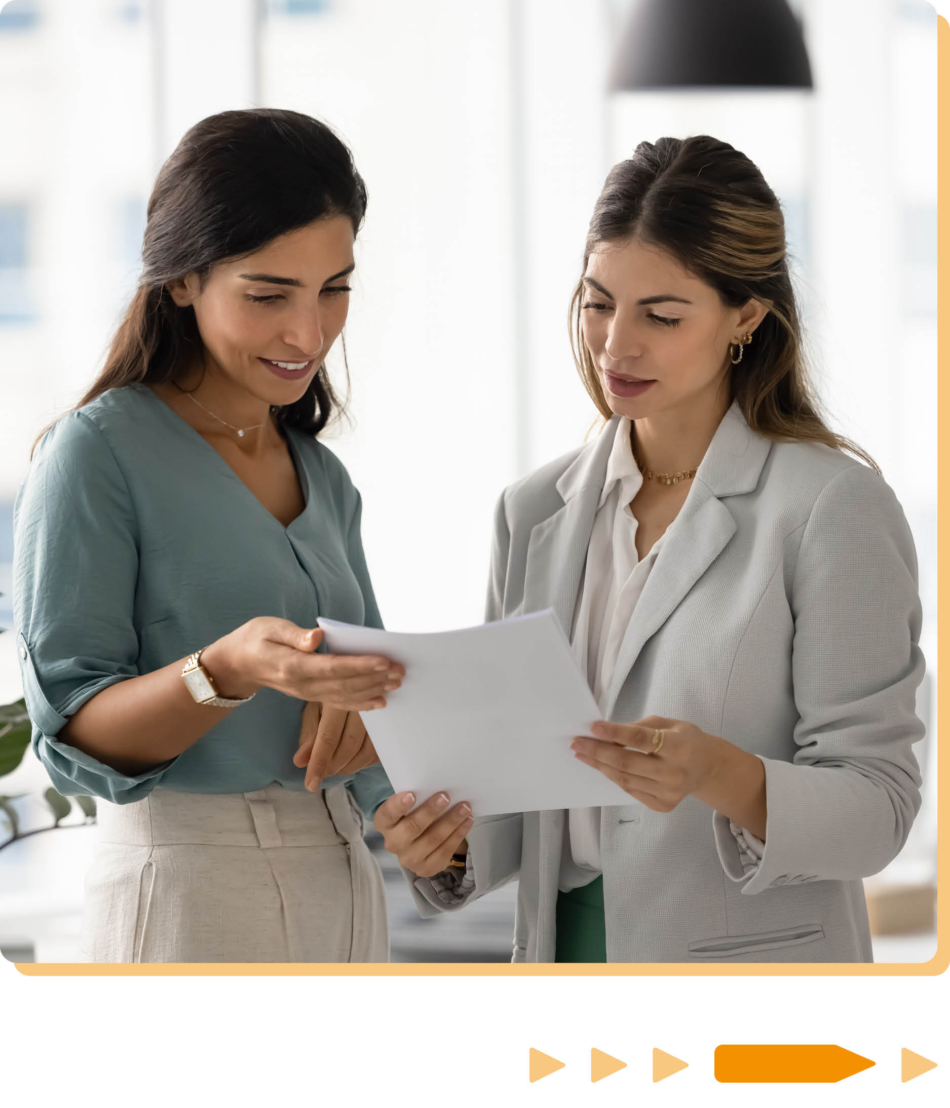 Two women discussing some work