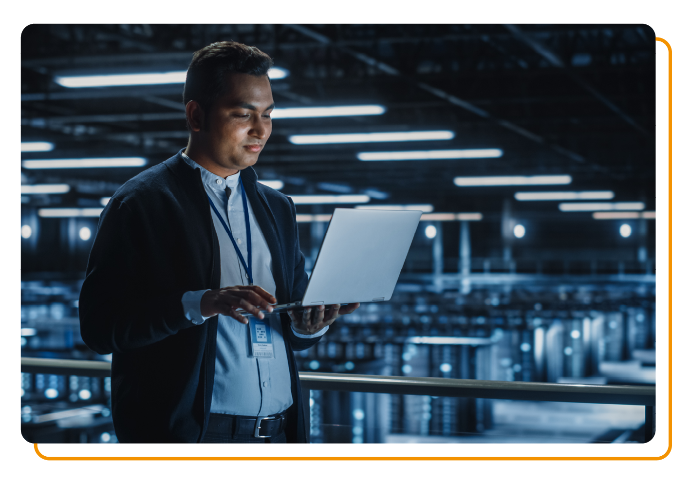 Man stood with laptop in cyber security room