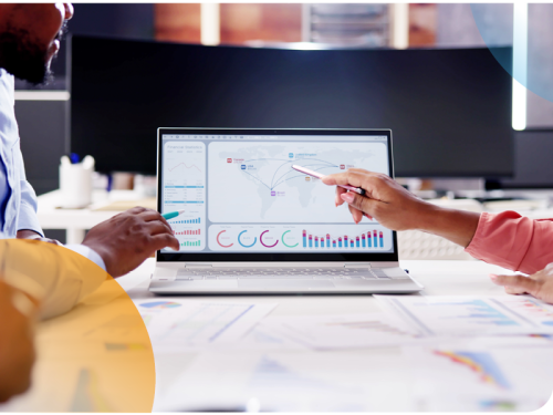 Image of two business professionals analysing data on a laptop