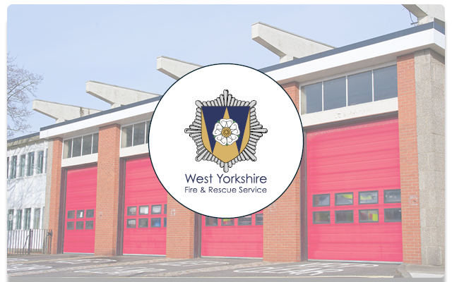 Image of a UK fire station with West Yorkshire Fire and Rescue logo