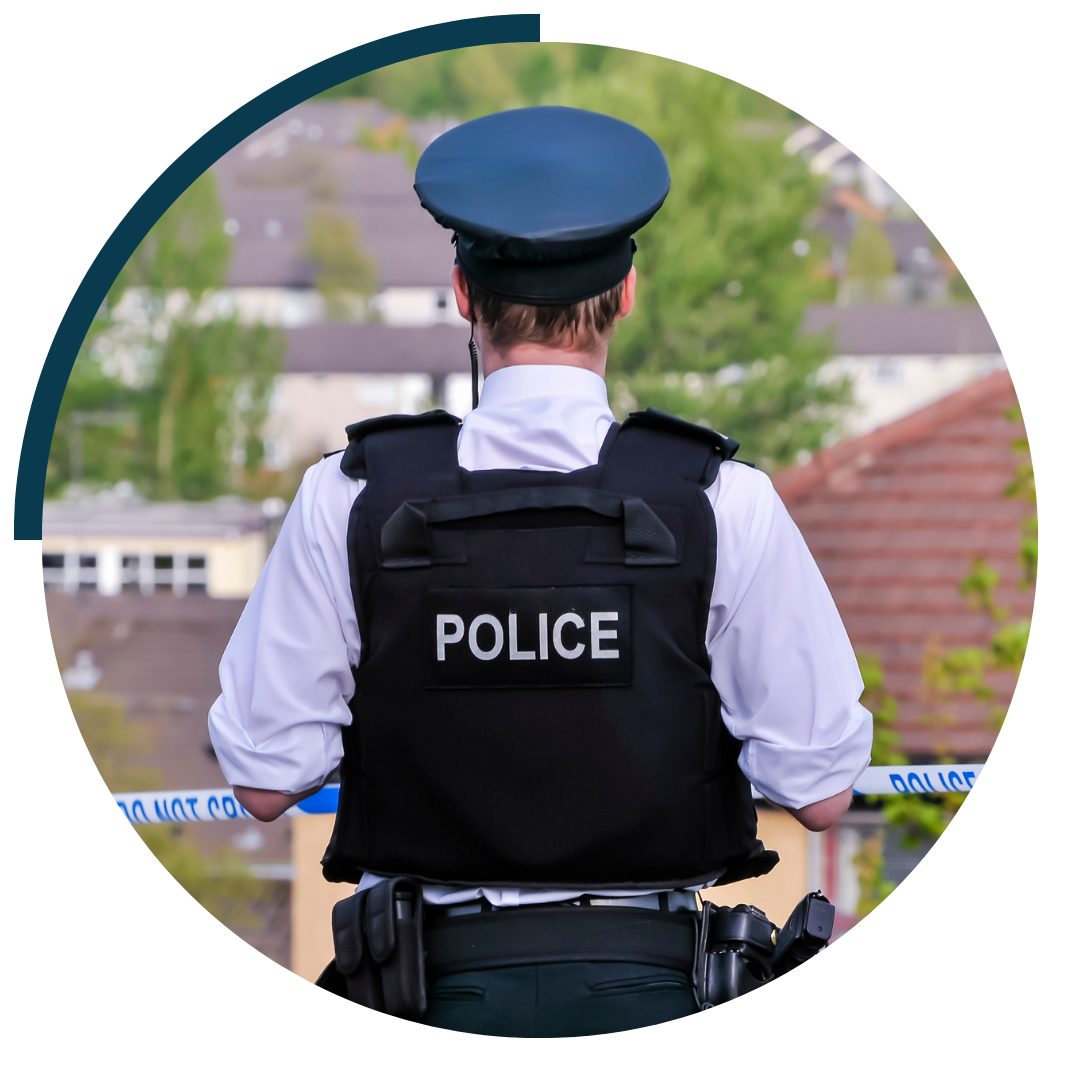 image of police mans back in uniform