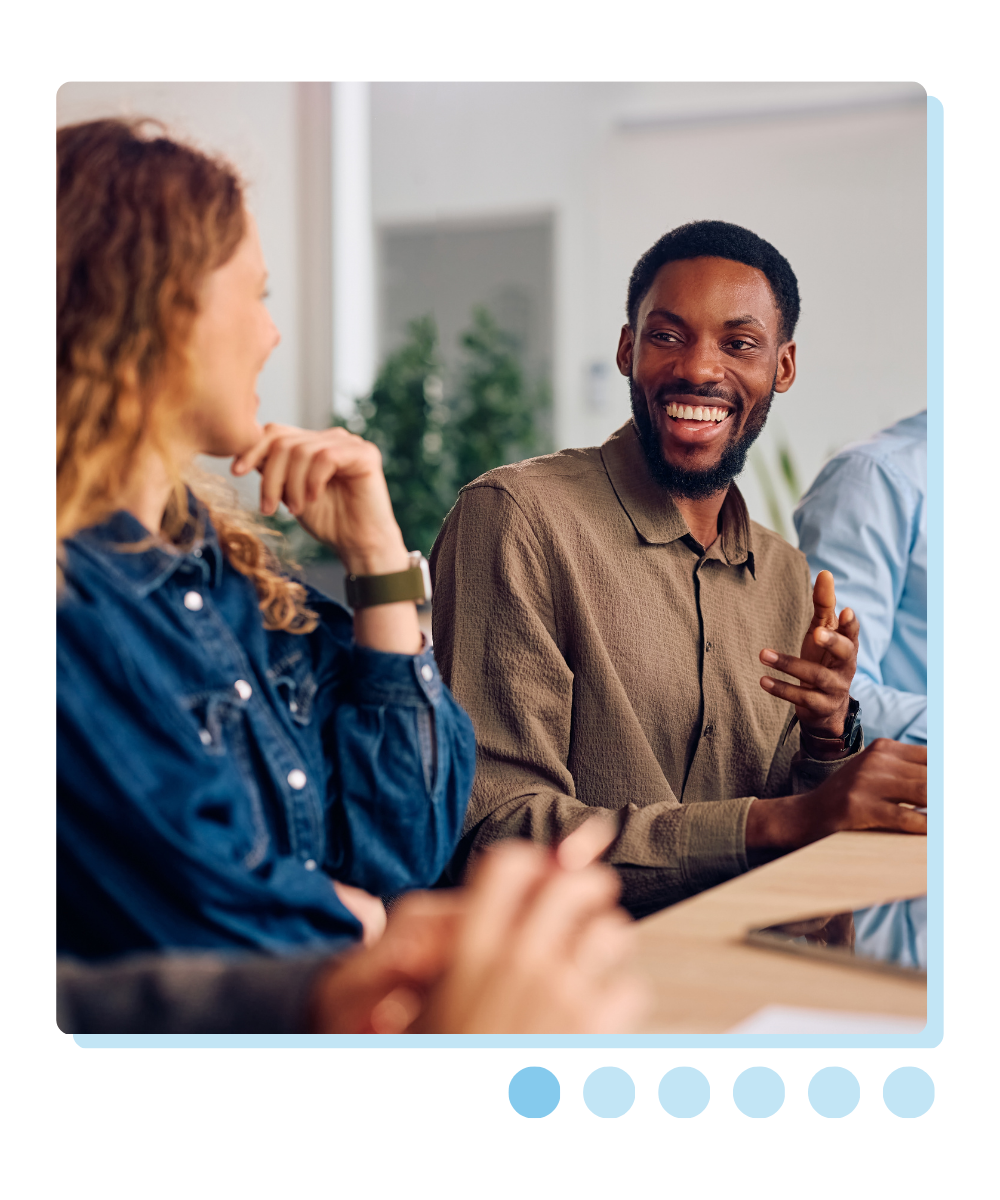 Man smiling in work environment