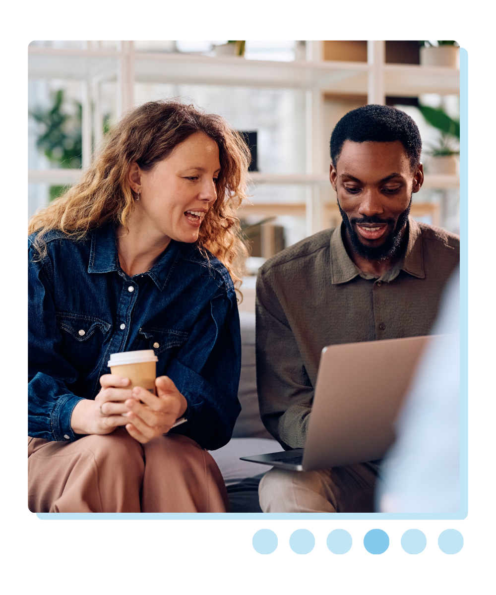 Woman and man talking at work