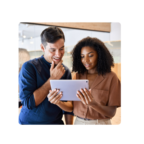 Two colleagues looking at tablet device